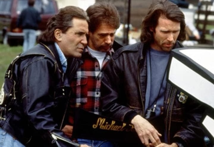 Photo of Hollywood superproducers Don Simpson and Jerry Bruckheimer on location with director Michael Bay.