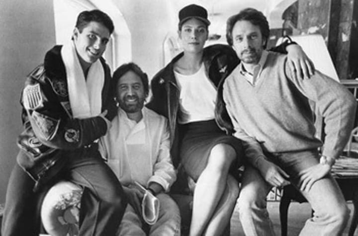 Photo of Hollywood superproducer Don Simpson in his home with some actors and partner Jerry Bruckheimer.