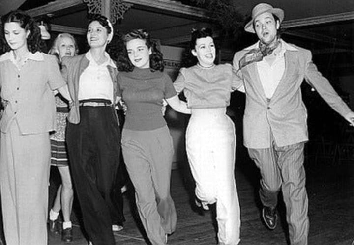 Photo of Orson Welles rehearsing the dancing girls scene in “Citizen Kane”.