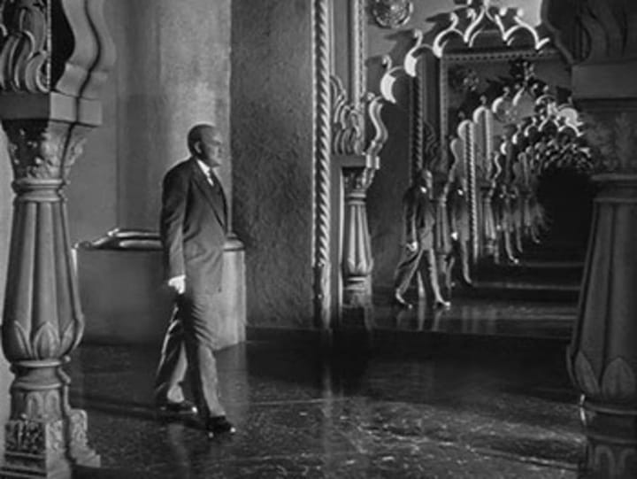 Photo of Orson Welles as Charles Foster Kane becoming lost in his own reflection in “Citizen Kane”.