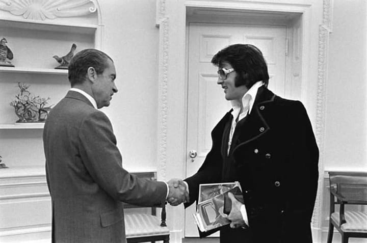 Photo of Elvis Presley shaking hands with President Richard Nixon.